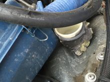 Is this a radiator overflow or something? It screws to the wheel well and looks like there should be a lid...it is on the right front corner of the engine bay.