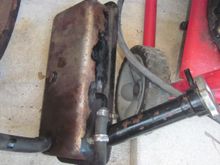 Coolant expansion tank.  Needs to be cleaned and repainted but no hole or damage