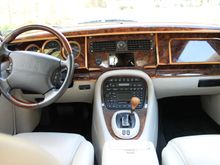 The center face-level vents are fed directly from the heat exchanger housing, while defroster, footwell and rear vents are ducted.  Blowers are housed behind the outboard footwell covers.