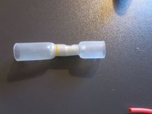 Step down crimp connector, with heat shrink outer. In fact I used a second smaller heat shrink tube inside the Anchor one, as the silicone wires were quite thin and this gave extra grip