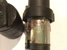 This looks to be where the problem occurred.  A leak of some sort leading to a good bit of corrosion.  The circle is where is says Buhler