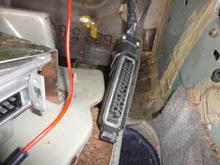 The digital Ignition ECU on L/H Drive Cars is in the R/H footwell.  Panel is secured by two 8mm nuts and two Phillips head screws.