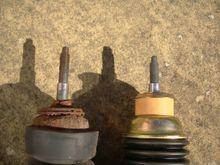 Original damper with buffer missing and replacement damper with yellow buffer clearly visible