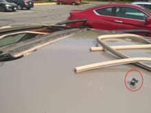 Headliner weatherstripping (upper right) & Small panel retention clip (circled). w/ top gone