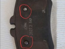 The two proud notches actually indented the outer part of the left rear caliper. 