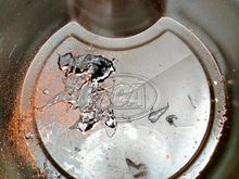 Tar-like substance in drain pan