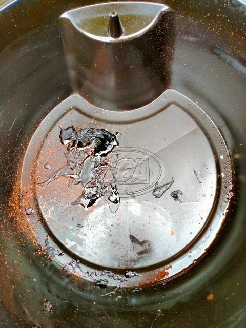 Tar-like substance in drain pan