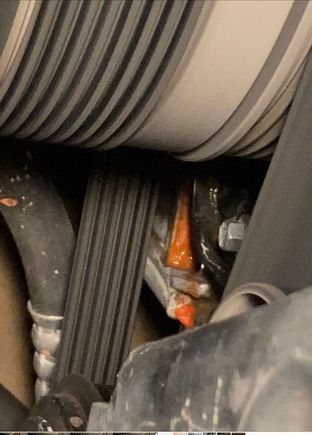 Sign of active coolant leak below the black front engine cover