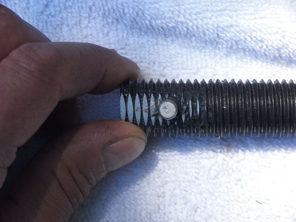 I filed a flat on the end of the threaded rod so I could center punch for the cross hole. I drilled thru with a 15/64" bit 1st then 1/4" and it gave me a nice tight slip fit for the dowel