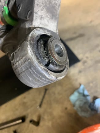 Rear lower outer ball joint bushing where it connects to spindle