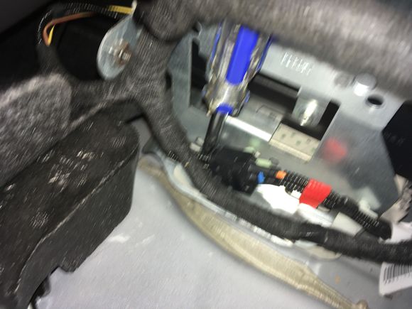 17. Now you can put your socket and driver onto the rear nut of the mounting bracket.