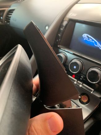 Then gently rotate cover in a anticlockwise direction as shown in relation to this photo angle. Once side tabs are disengaged cover can just be pull forward and off