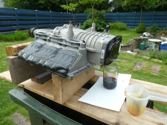 Draining rear bearing cover, and flushing.