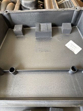 These are the foam blocks on the cover that hold the TCM in place.