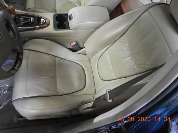 Looks like it's in the back seat but just the camera angle