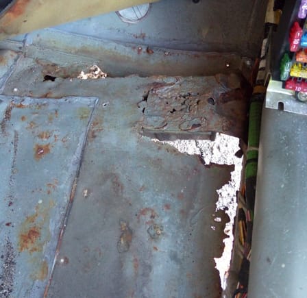 Rust hole in passenger's front floor