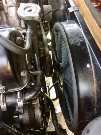 There's about an inch clearance there between the main pulley and the fan.