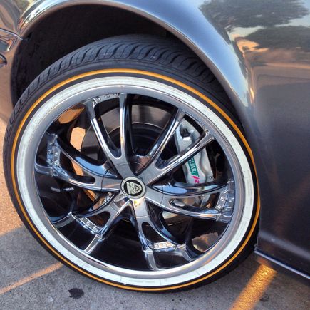 Close up on rim. I got the chrome rims sprayed with a tint of black chrome to match the cars paint. Also got the center cap for rim made with the Jaguar logo!