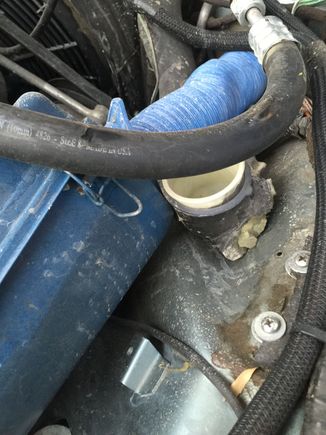 Is this a radiator overflow or something? It screws to the wheel well and looks like there should be a lid...it is on the right front corner of the engine bay.