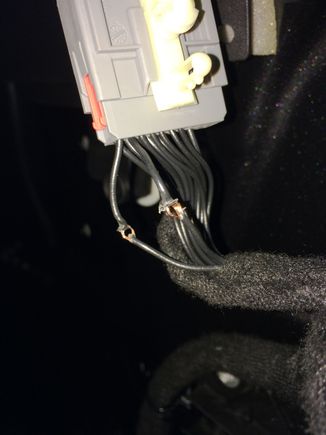 Here is the door side of the mirror harness connector. Pin #12 ground and #13 power as before. Notice how I cut the insulation only leaving the conductors in tact and then using a small pick, make a hole to insert the new wires through and then rapped them, soldered them and re-insulated.