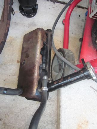 Coolant expansion tank.  Needs to be cleaned and repainted but no hole or damage