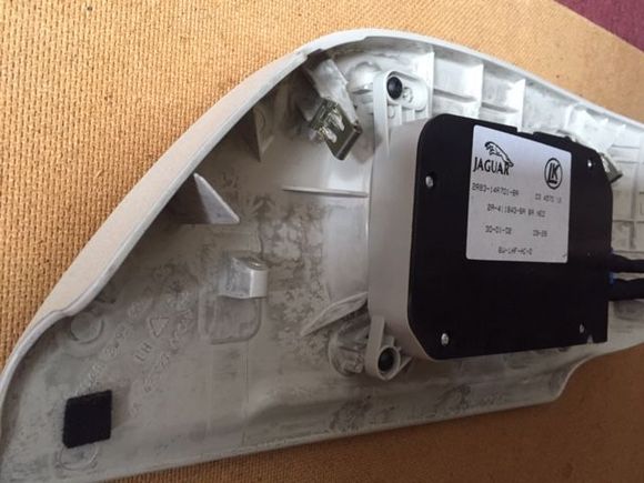 Seat switch housing, 2off TX20 screws to remove from underneath, notice the spring-fixing clips are set at 45° angle, that’s the best direction to remove them.

