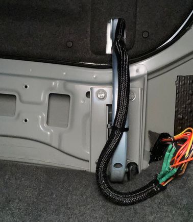 Woven conduit up the hinge is probably overkill but I let is stay....