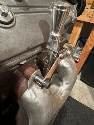 Lokar flexible dipstick in place with a longer bolt and spacer to also hold manifold heat shield in place properly.