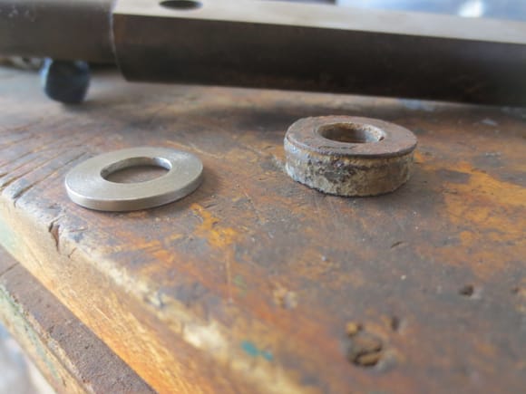Camber shims, original on the right