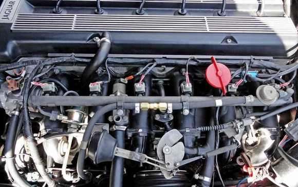 So just to be clear, from what I remember is that the return line is where the FPR is connected. The line that feeds the fuel rail is the one with the check valve. Correct?  The flow of fuel according to this pic of your engine is from left to right. Thanks! 
I replaced the plugs, cap and rotor, but still experience starting issues. I have a really good check valve ready to so I figured tomorrow would be a good day to install it