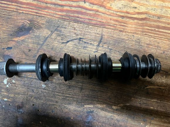 Passenger side how came off vehicle. Three shims. Note no dished washer on left and two on right