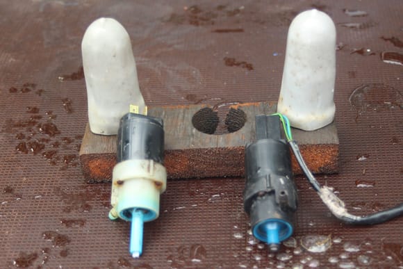 The Windscreen Washer Motors with their protective Sheaths which just slip over and wiring them up is as simple as plugging them in.

The Newer Washer Motor is the one on the left while the one on the right came out of my Parts Car.

But I swapped around the Hoses, so the later style of Washer Motor was used on the Windscreen.