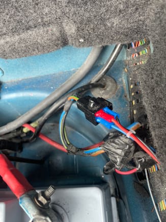 And these are the three wires (ground, permanent live and switched liver) attached into the auxiliary connector close to the battery positive terminal.