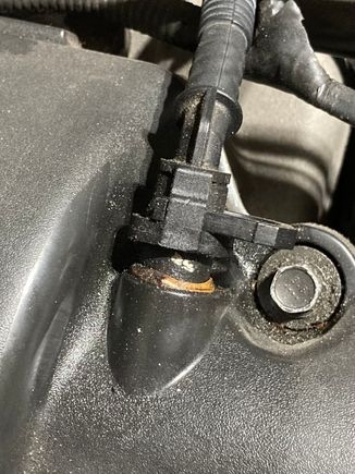 You have to disconnect this plastic pipe ***and it will likely break*** if it’s the original one and you aren’t careful. There is a small hole inside that valve cover that needs to be cleared out with a particular size drill bit. 