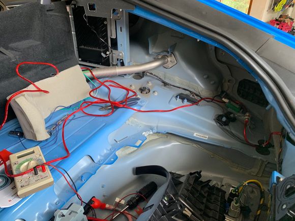 After removing the trim from the trunk I ran the red 8 gauge 12V power wire along the right side. I did not Dynamat anything back here