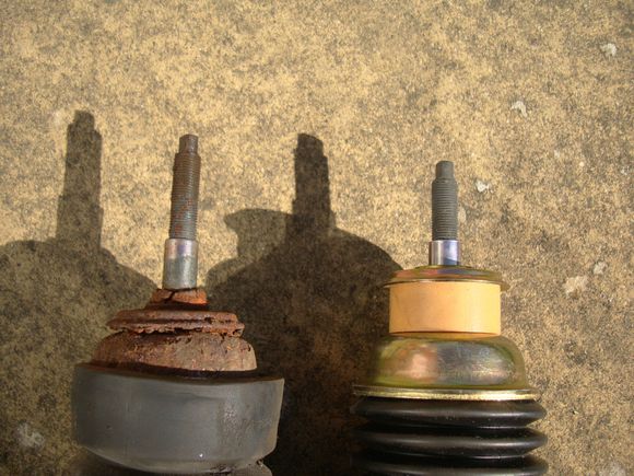 Original damper with buffer missing and replacement damper with yellow buffer clearly visible