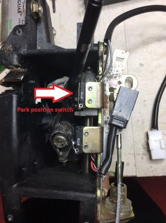 With the shift lever in the "P" position (j-gate bezel removed), the lever depresses the park position microswitch.