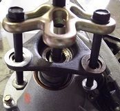 you don't need a "special output flange puller", I just used a harmonic balancer  puller with nuts on the three long bolts in the kit.
