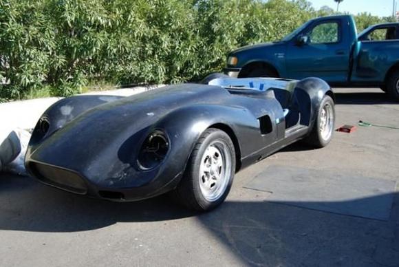 After 4 very long days on the left coast, this is the rolling chassis with a body.  The wheels are borrowed as PS Engineering had not yet finished making the custom offsets and widths I had sent to them earlier.   This is the original shape of the "narrow body".  the final version is MUCH wider!