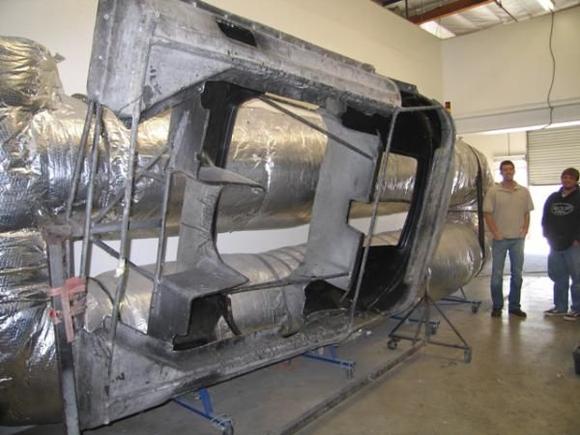 My brother and I toured the facility that built the bodies.  Very cool place.  Here are a few shots of the facility and one of the body molds.  The insulated thing in back is their autoclave for the high dollar piece.  this is the actual mold for the rear portion of the body.