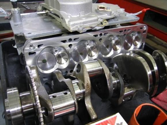 Here is one of the heads and the crank back from machining.