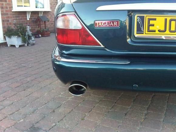 chrome trim added to the rear along with "proper" sized tailpipes.