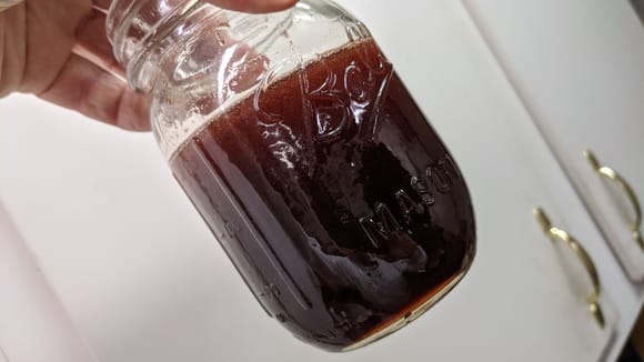 This is the second extraction of fluid from the reservoir.  It contains some new fluid mixed with old.   The lighter color at the top is lot as visible. 