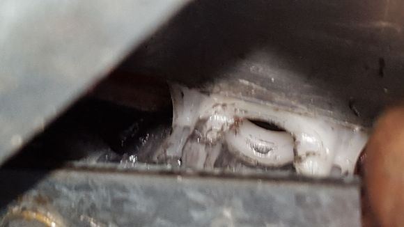 This is the white nylon connector.  Regulator should snap into this.