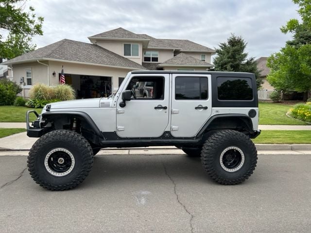 2012 Jeep Wrangler - 2012 Wrangler Unlimited 57k miles Built, UD 60's, Coils, PS Armor, 40's, Leather, NAV - Used - VIN 1c4bjweg4cl253579 - 57,000 Miles - 6 cyl - 4WD - SUV - Silver - Windsor, CO 80550, United States