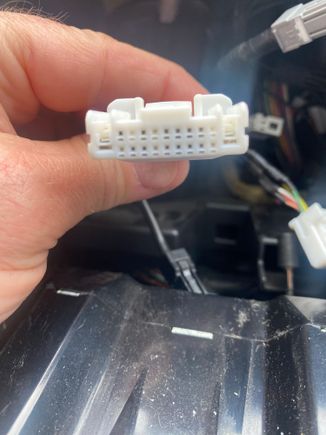 Smaller power connector that plugged into rear of current unit.