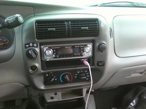 Came with a Pioneer head unit.  Guy through in the stock cd player as well.