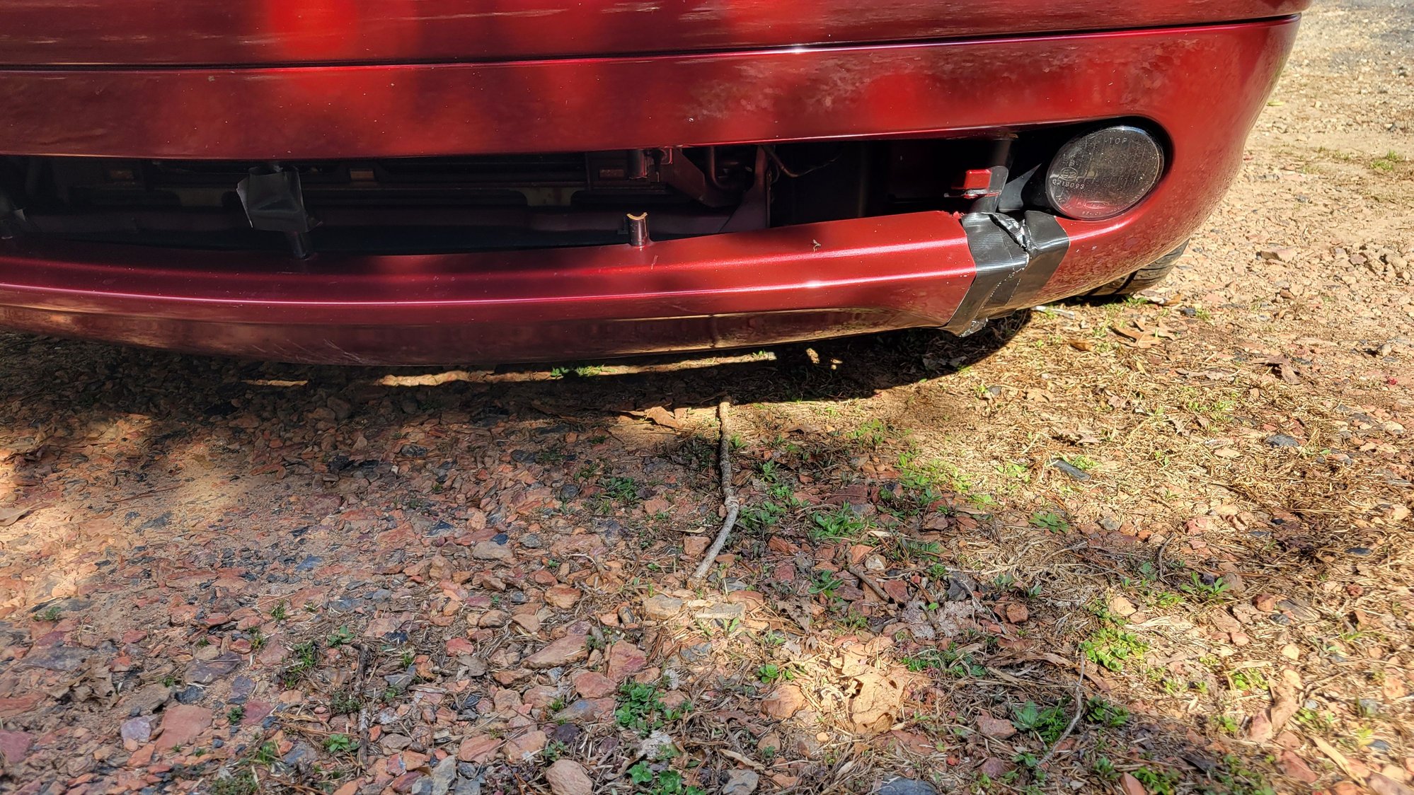 Front bumper with broken lower grill