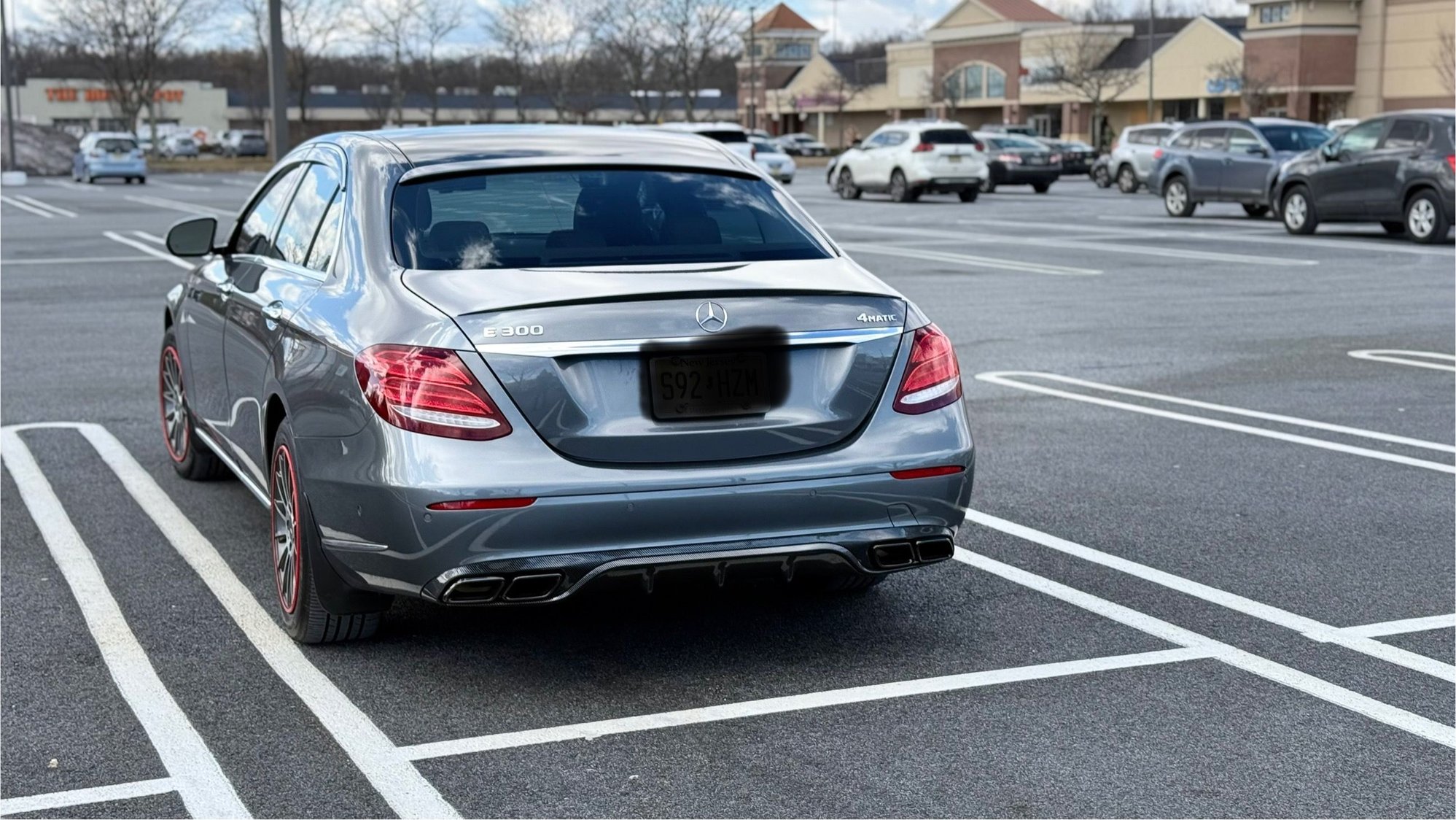 Carbon fiber look diffuser and black chrome pipes inside on Luxury/Exclusive model