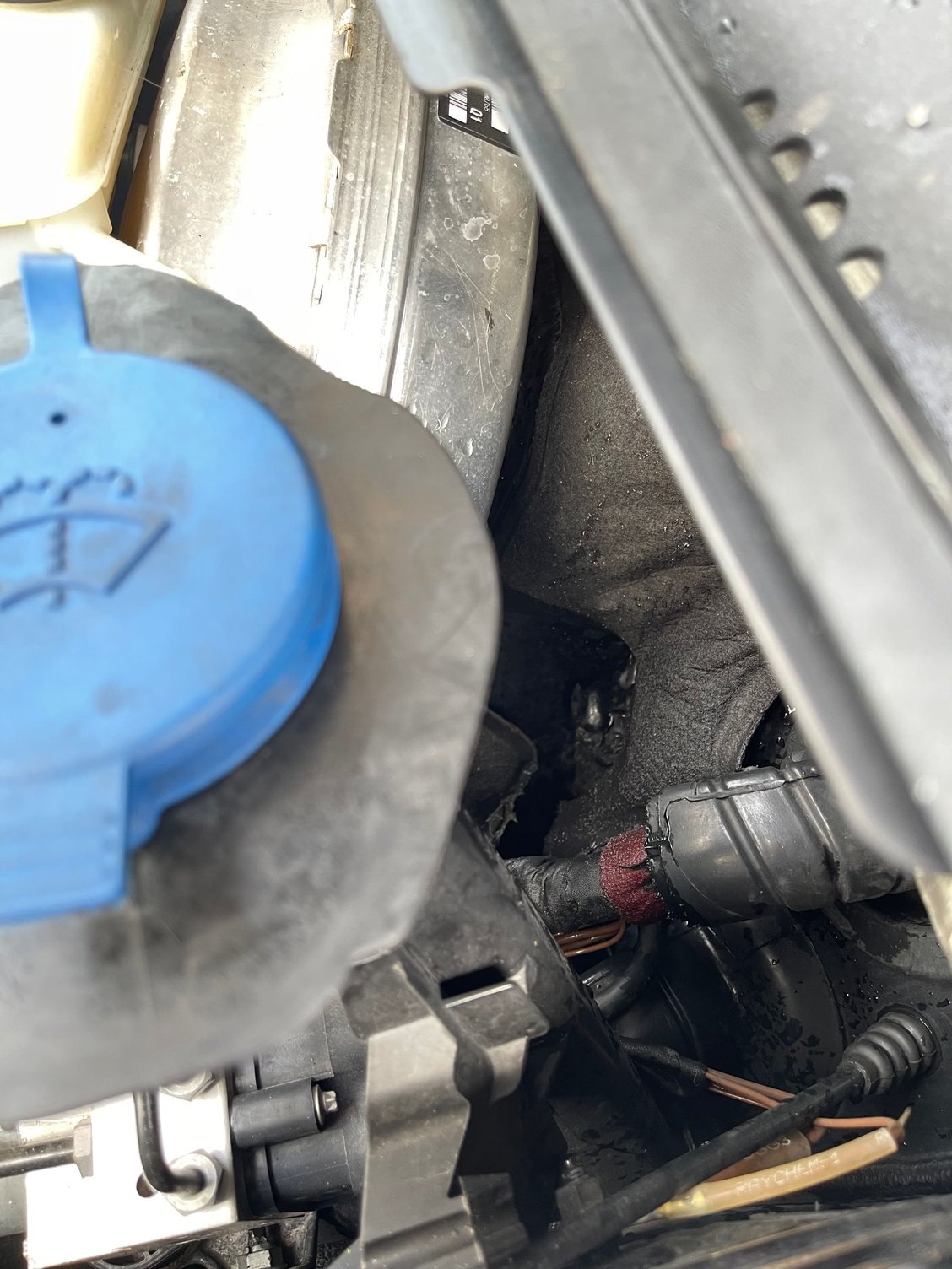 Open hole from engine firewall to interior of vehicle. 